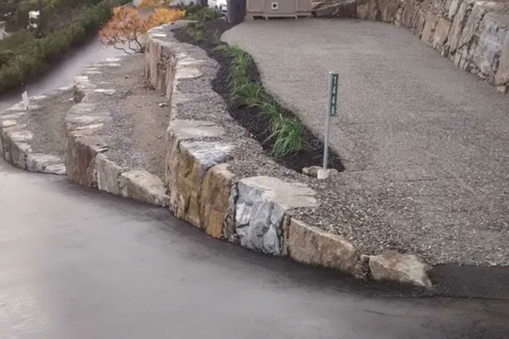 Rattlesnake tiered rock wall along driveway